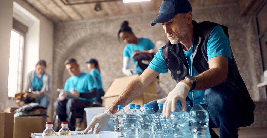 Group of volunteers packing water bottles